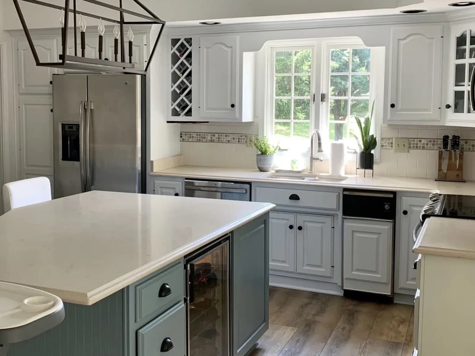 After: Cherry cabinets painted a soft gray-green, island included
