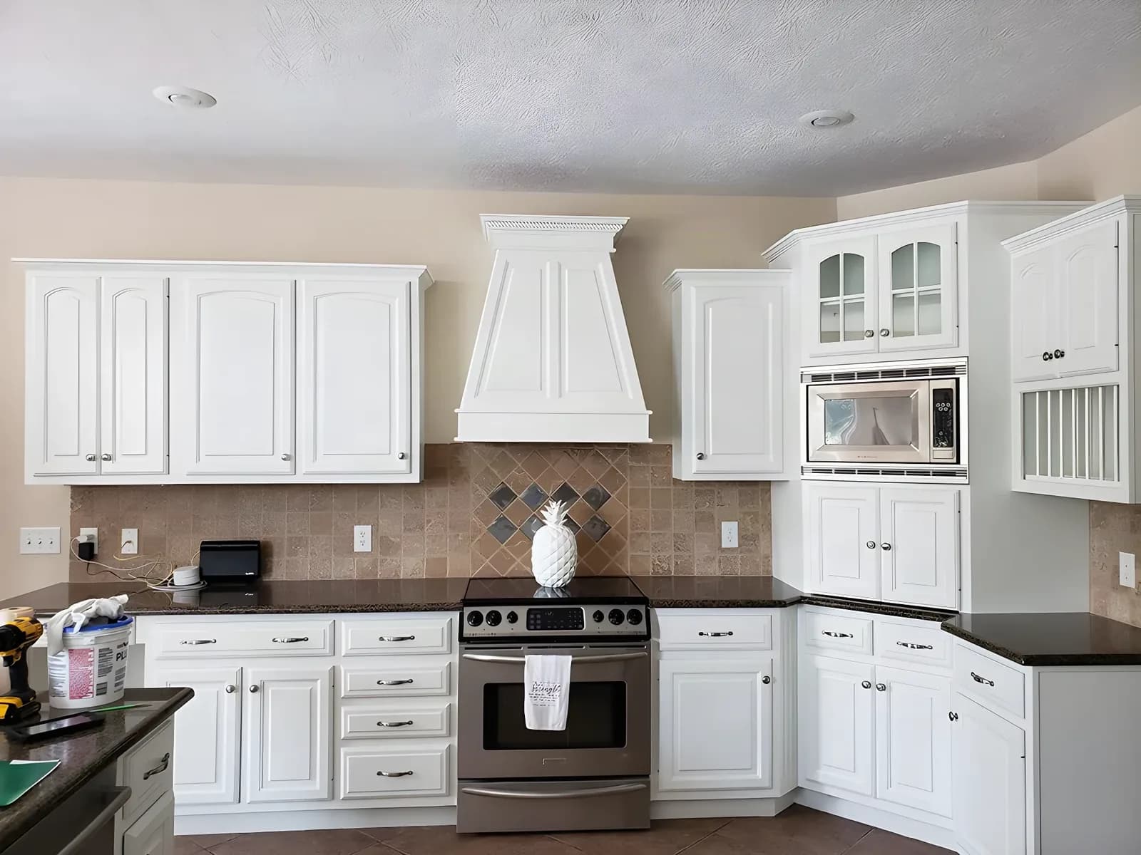 Oak kitchen painted white, range hood and all
