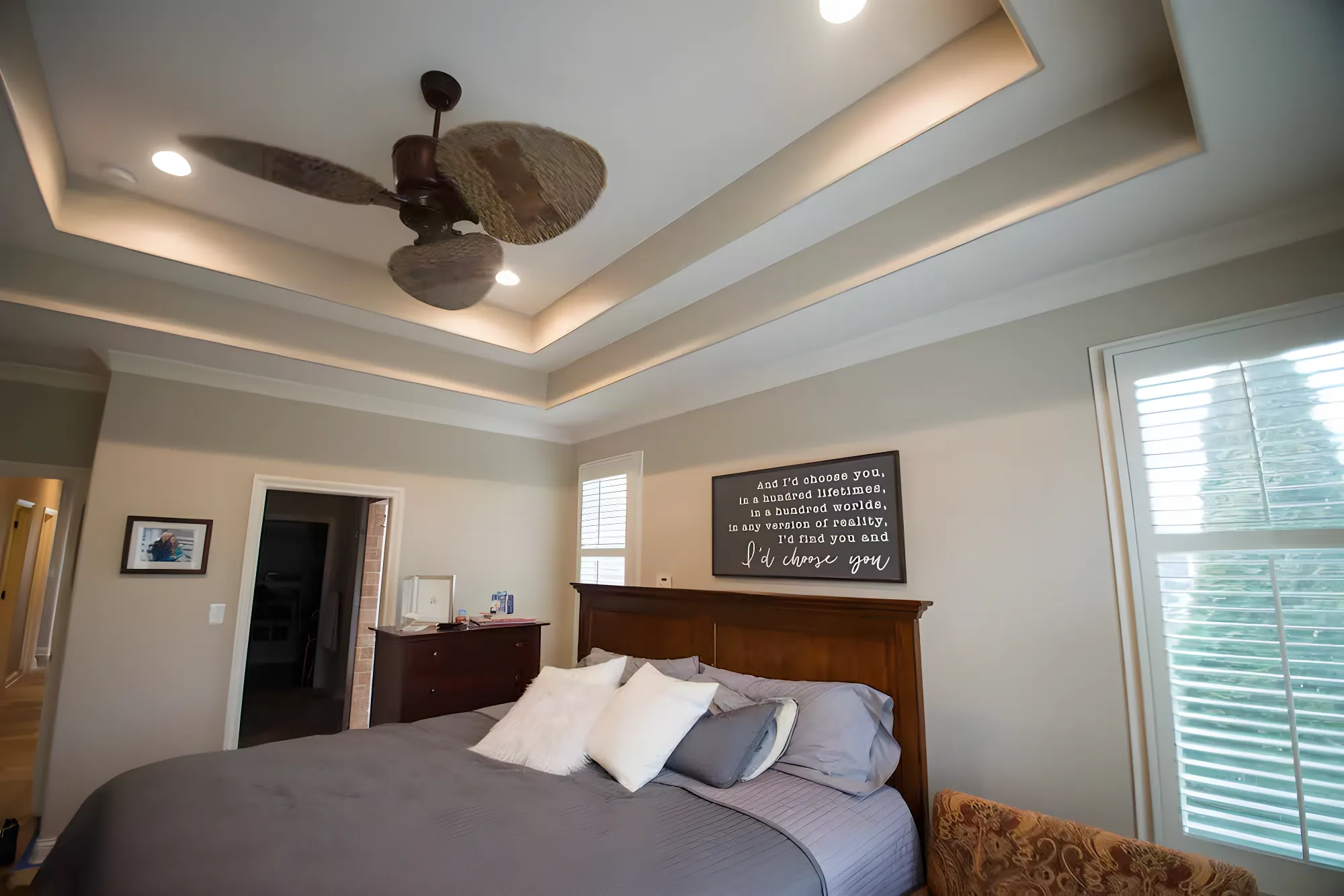 A bedroom with a freshly painted tray ceiling by ALL IN Painting